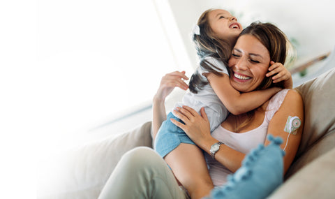 A woman and child hugging