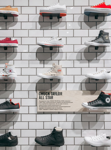 Wall of trainers in a shoe shop. Photo by La Miko from Pexels