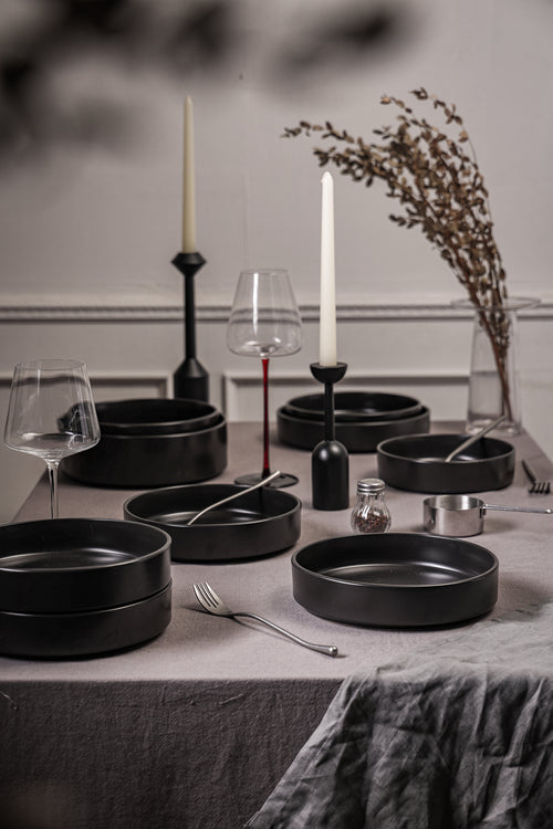 Stone Lain Celina coupe serveware bowls and platters in black in a moody holiday table setting all in black and elegantly styled.