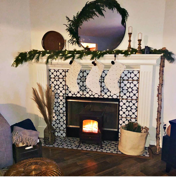Tile stickers decorate a fireplace facade