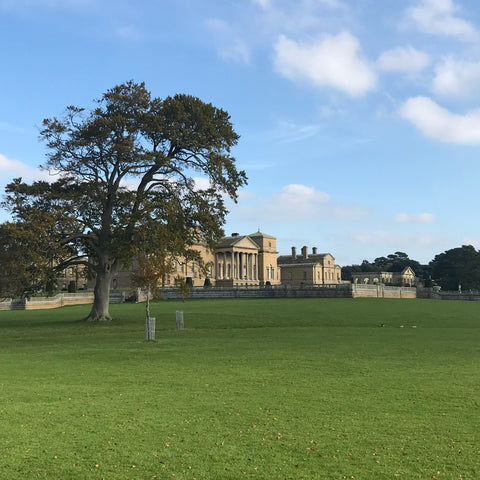 Holkham Hall in Norfolk under a bright autumnal blue sky