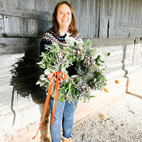 Ellen, Founder of Rhubarb & Hare with her handmade wreath December 2023