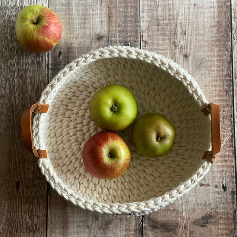 A handmade crochet basket by Kate Keller Handmade filled with apples