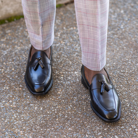 Black loafers for men worn without socks