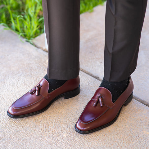 Mens slip on shoes in burgundy worn with socks for the office