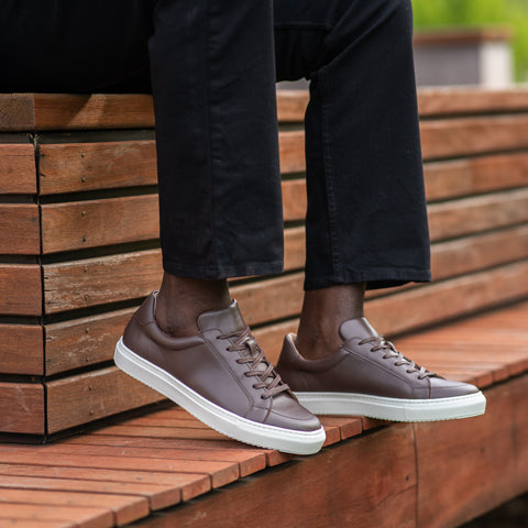 Brown leather sneakers paired with casual outfit for going out