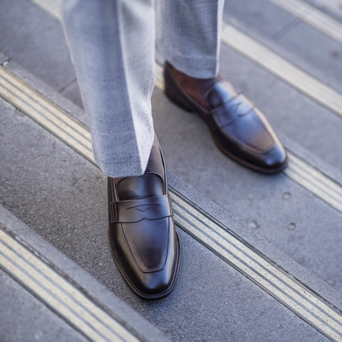 Mens loafers shoes in brown leather worn with suit