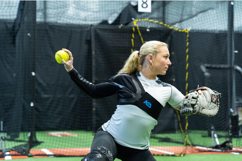 Softball player wearing Kinetic Arm