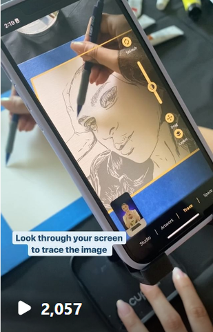 photo of Cupixel app being used on a mobile phone to draw a woman's face