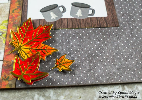 Adding 3D autumn leaves sticker embellishments to scrapbook page