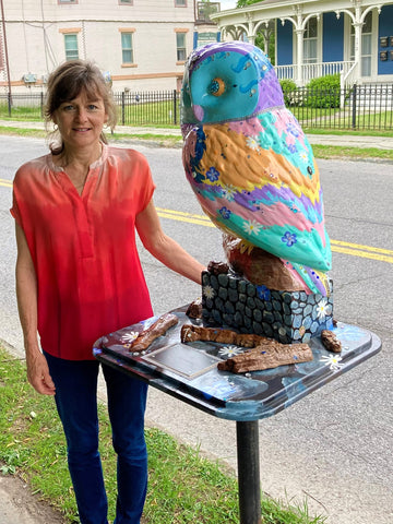 artist standing next to her hand-painted owl in Saugerties NY