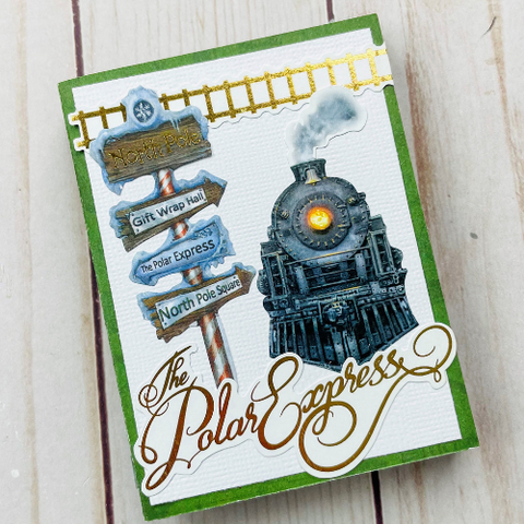 front cover of mini scrapbook album featuring train from The Polar Express