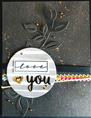 handmade card made with black watercolor paper with die cut leaves and grey die cut circle with the words Love You