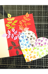 die cut leaves shown over red card base 