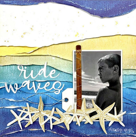 beach-themed scrapbook layout featuring single photo of boy on a background blues and yellow with starfish embellishments