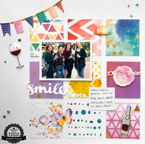 scrapbook page featuring a group of women on a wine adventure. The page decorated with colorful paper and wine-themed sticker embellishments