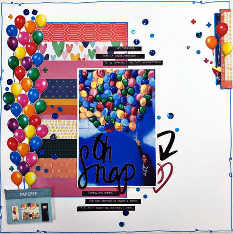 scrapbook page featuring a young woman "grabbing" onto a huge balloon bouquet painted onto a wall with the words "oh snap". Page is decorated with colorful balloon puffy stickers.