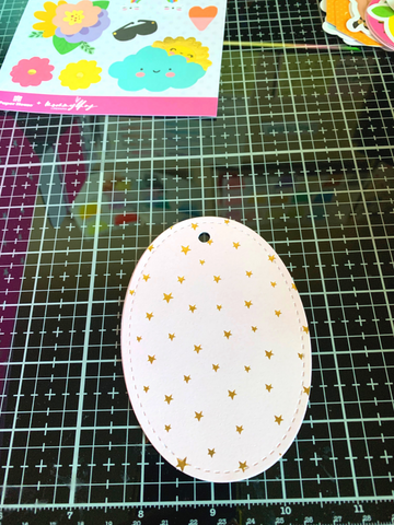 oval die cut paper with gold stars