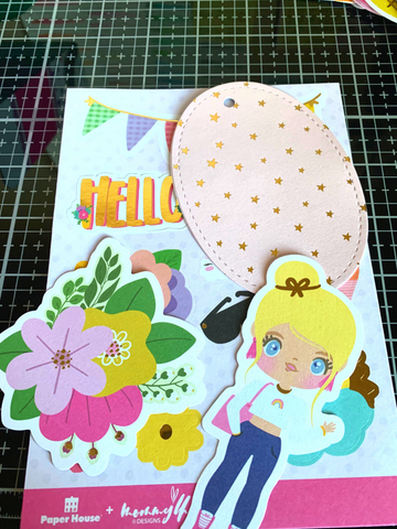 two stickers selected from Mommey Lhey sticker book. One stick is an illustrated blonde girl in jeans and the other is of fuchsia, yellow, and lavender flowers