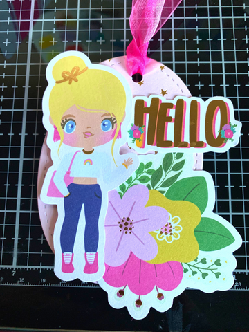 finished Mommey Lhey gift tag with colorful stickers and the word Hello