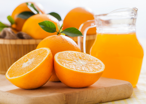 oranges and pitcher of orange juice