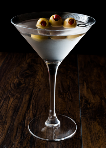 dry martini cocktail with olives