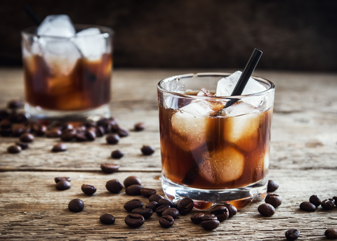 two mind eraser cocktail's with coffee beans on table