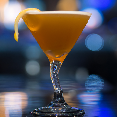 Canadian cocktail with lemon peel garnish
