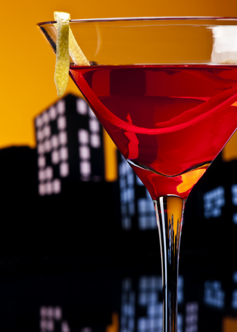 big apple cosmo with buildings in background