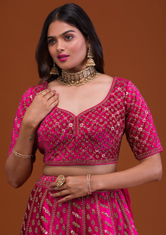 PETAL PINK LEHENGA SET WITH CONTRAST MULTI COLOURED EMBROIDERY PAIRED WITH  A MATCHING DUPATTA AND SILVER AND COLOURED EMBELLISHMENTS. - Seasons India