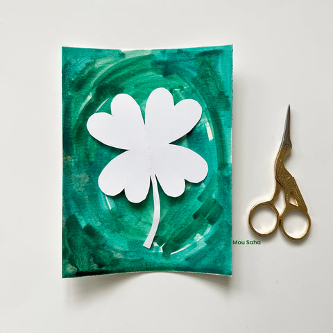 Watercolor four leaf clover and scissors