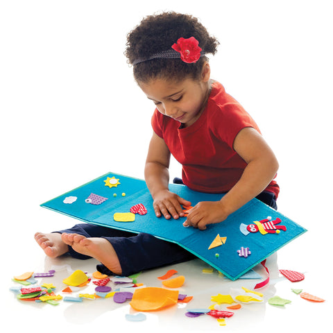 Girl playing with Fun Felt Shapes