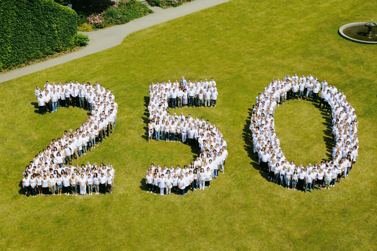 People standing in formation to write out 250