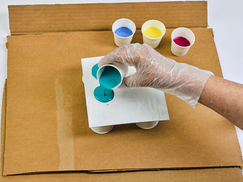 Canvas board with paint cups
