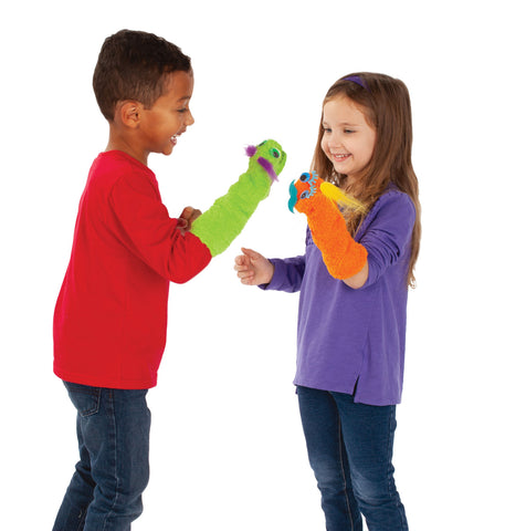 Two kids playing with sock puppets