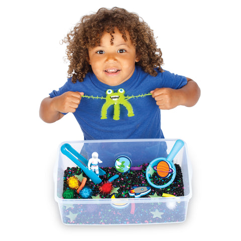 Child playing with outer space sensory bin