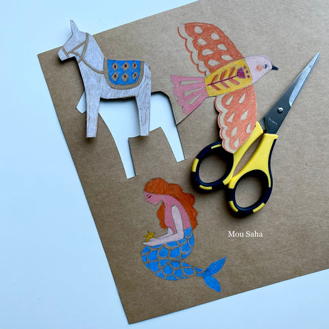Donkey, bird, and mermaid cut out with scissors