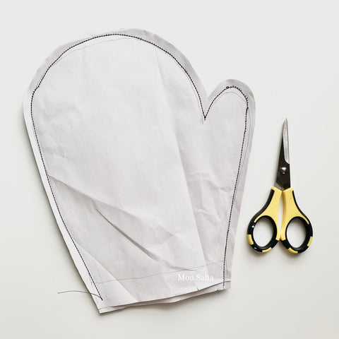 Mitten shaped wrapping paper with scissors