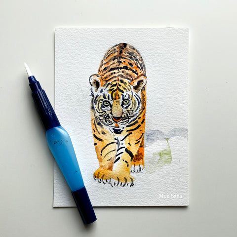A watercolor tiger with a water brush