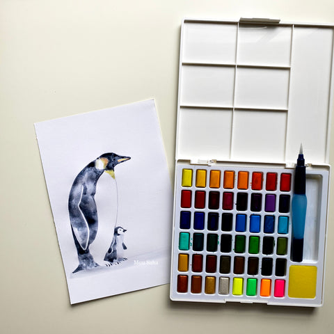 Watercolor penguin with watercolor pan