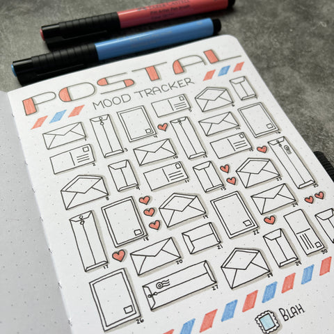 Bullet Journal with postal mood tracker icons and Pitt Artist Pens