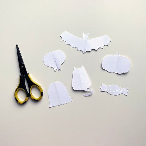 Paper cut into holiday shapes