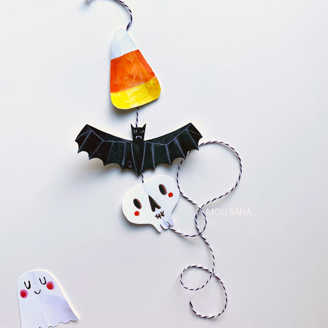 Paper Halloween shapes on string