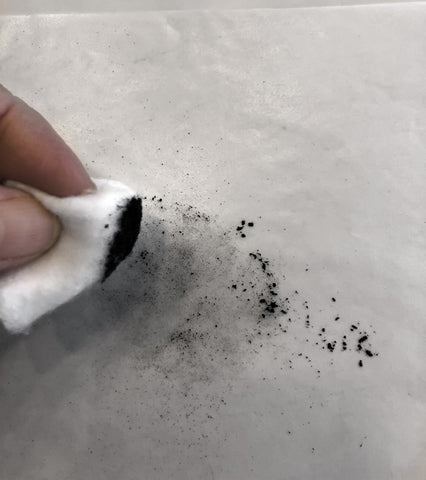 Graphite dust and cotton ball 