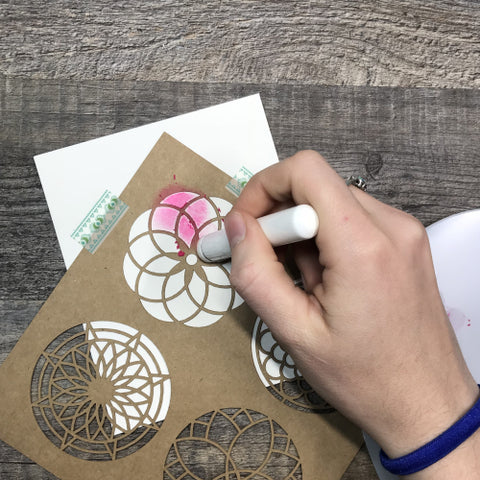 Adding Gelatos color to paper using floral stencils