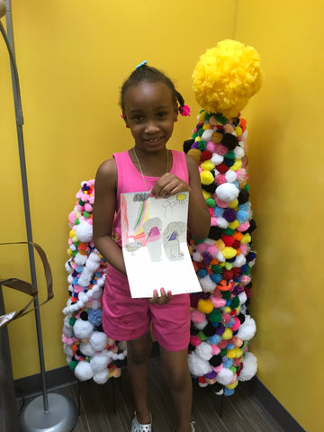 Child Holding Her World Colors Portrait