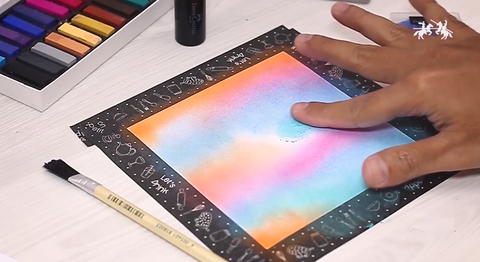 Soft pastel art with artist's fingers