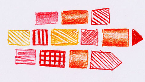 Red, orange, and yellow shapes sketched on cold press paper