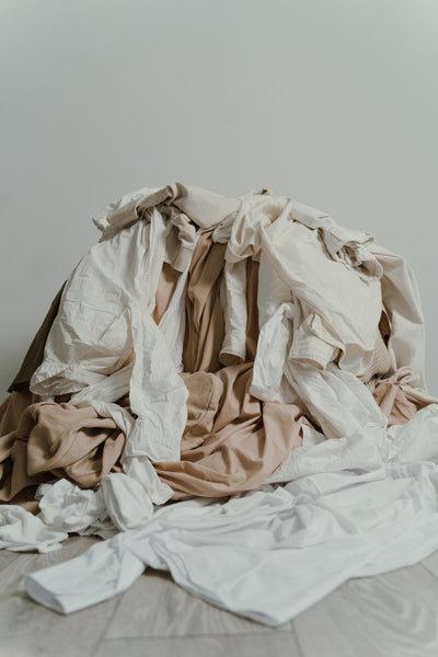 Piles of clothing | Tluxe