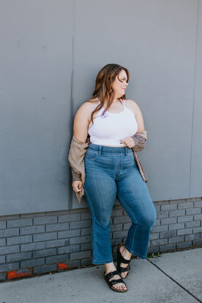 Plus size woman models flared bootcut jeans